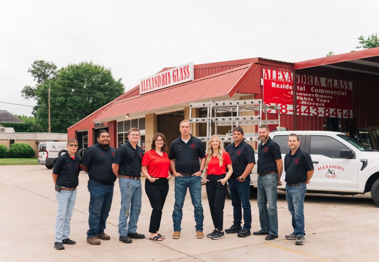 The Alexandria Glass crew lined up in front of the storefront on Jackson Street